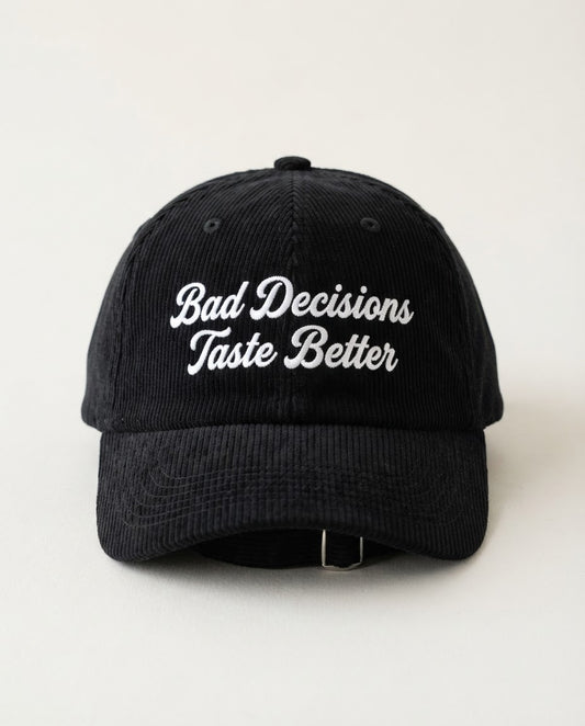 Bad Decisions Taste Better corduroy dad hat, white brush-script embroidery